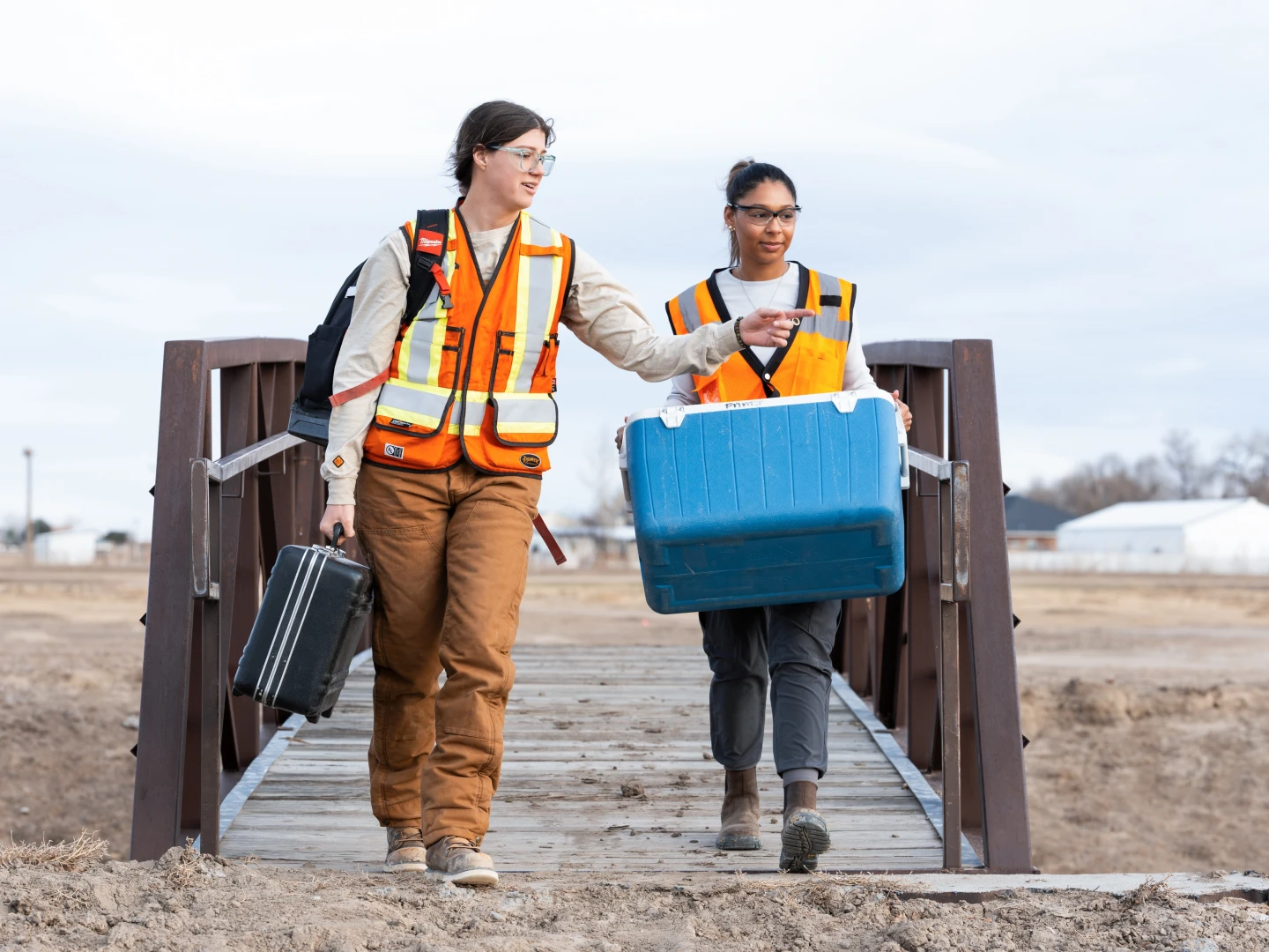 Environmental field teams coordinating site investigations and sample collection in remote locations.