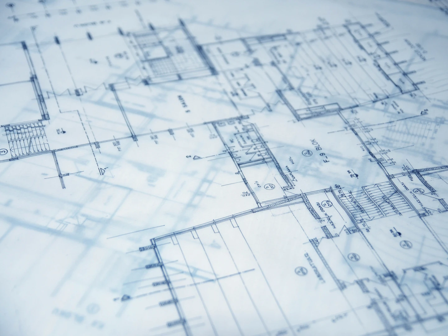 Close-up of architectural blueprints showing building plans and technical drawings