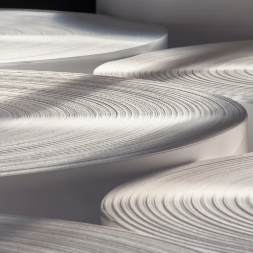 Rolls of industrial white paper.