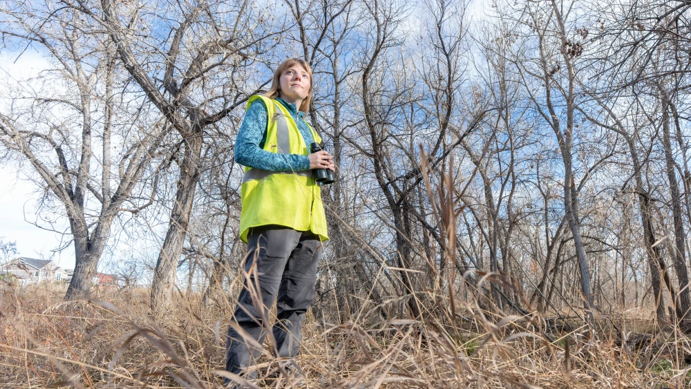 Environmental scientist conducting habitat assessment and ecological field surveys to support natural resource planning and restoration projects.
