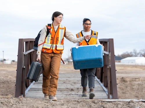 Environmental field teams coordinating site investigations and sample collection in remote locations.