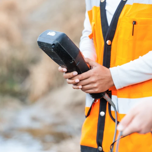 Environmental technician using field monitoring equipment