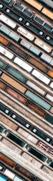 Aerial view of a rail yard with multiple freight trains and tracks arranged in parallel lines