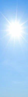 Shining sun with rays and clear blue sky background.